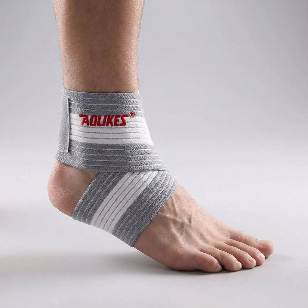 Adjustable ankle support wrap with targeted compression and breathable construction