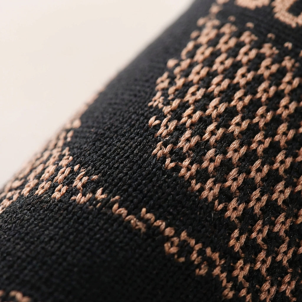 Compression ankle support sleeve with targeted reinforcement and breathable knitted construction