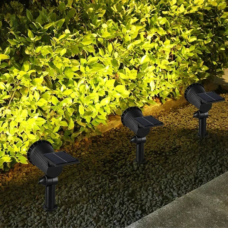 Solar-powered garden spotlight with adjustable LED beam and ground spike