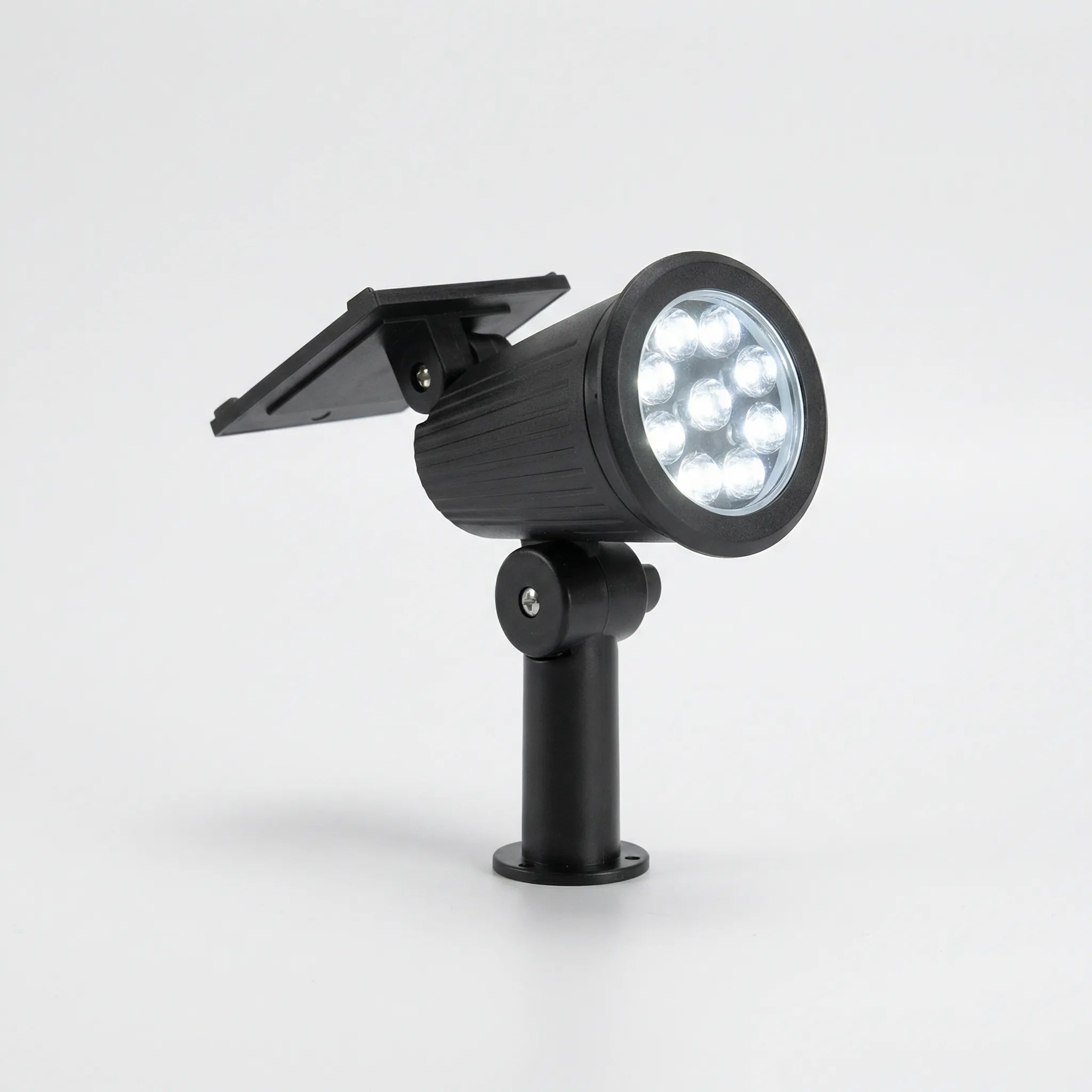 Solar-powered garden spotlight with adjustable LED beam and ground spike