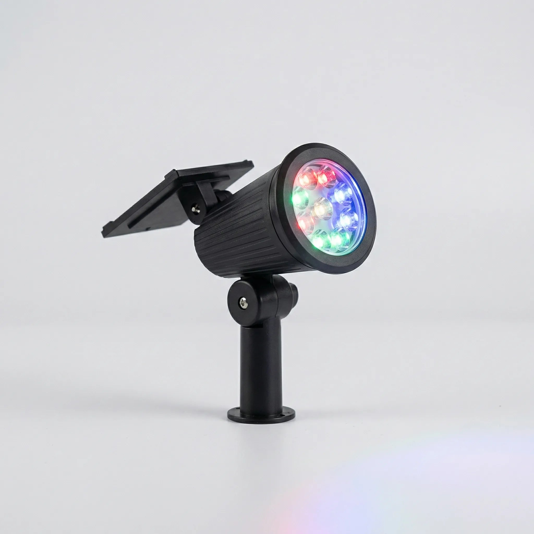 Solar-powered garden spotlight with adjustable LED beam and ground spike