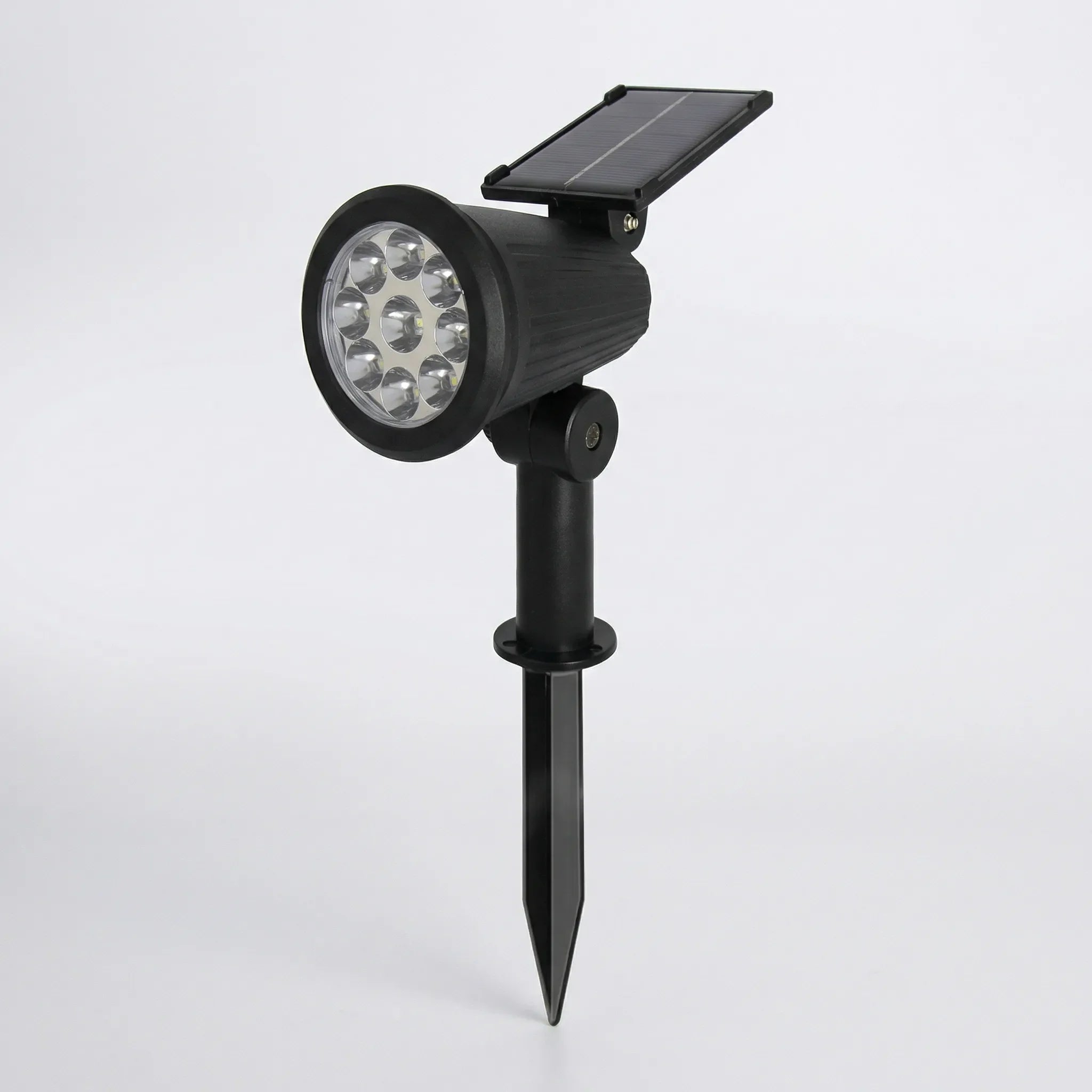 Solar-powered garden spotlight with adjustable LED beam and ground spike