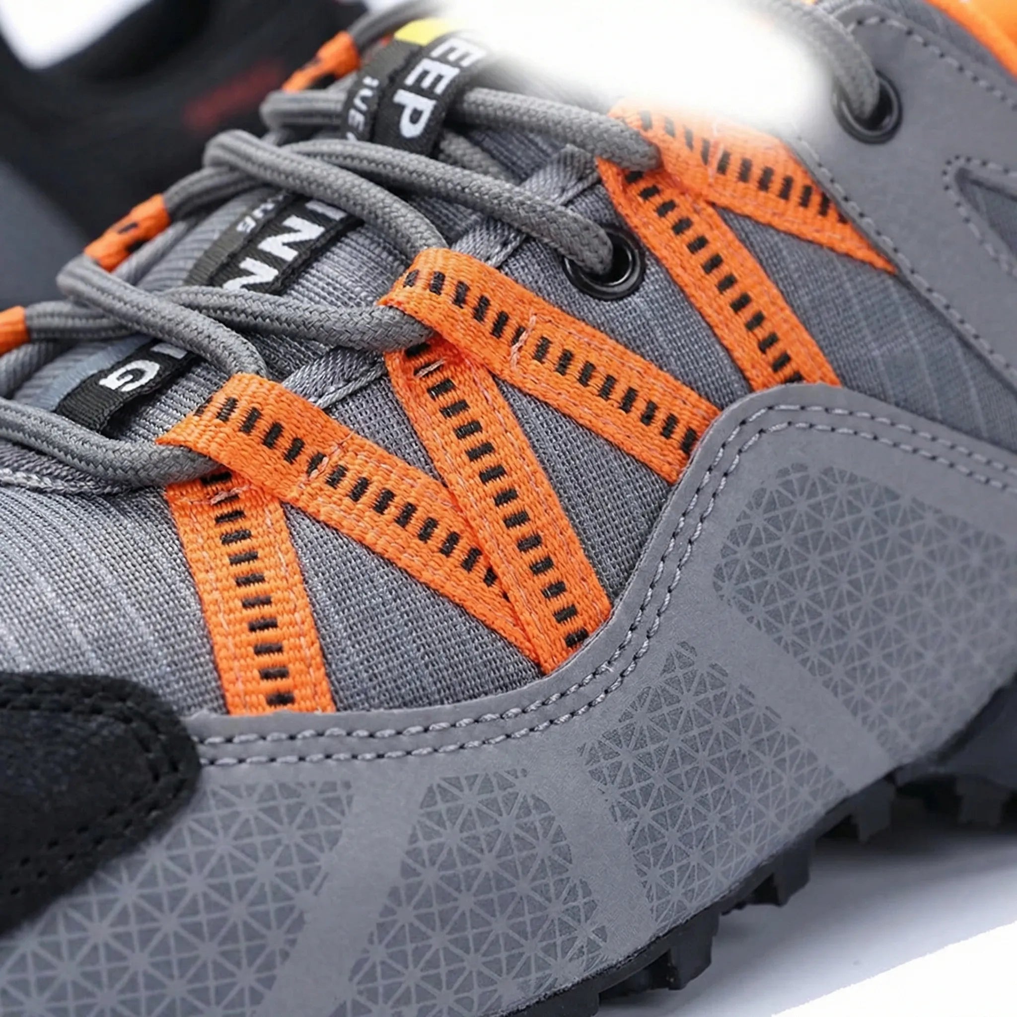 Men's outdoor sneaker with multi-terrain lugged sole and reinforced toe cap