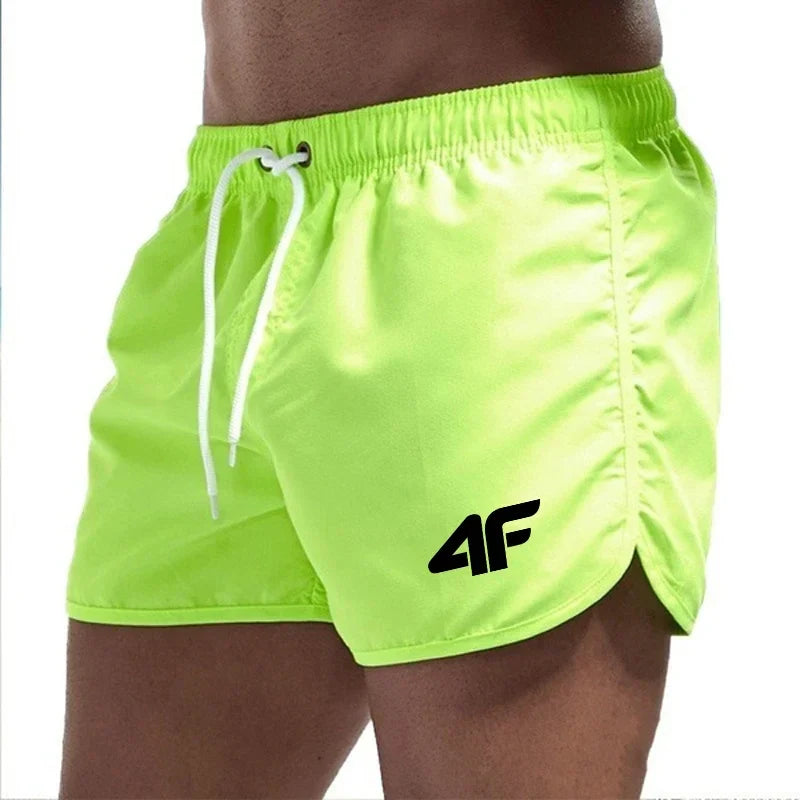 Men's short length swim trunks with quick dry fabric and side pockets