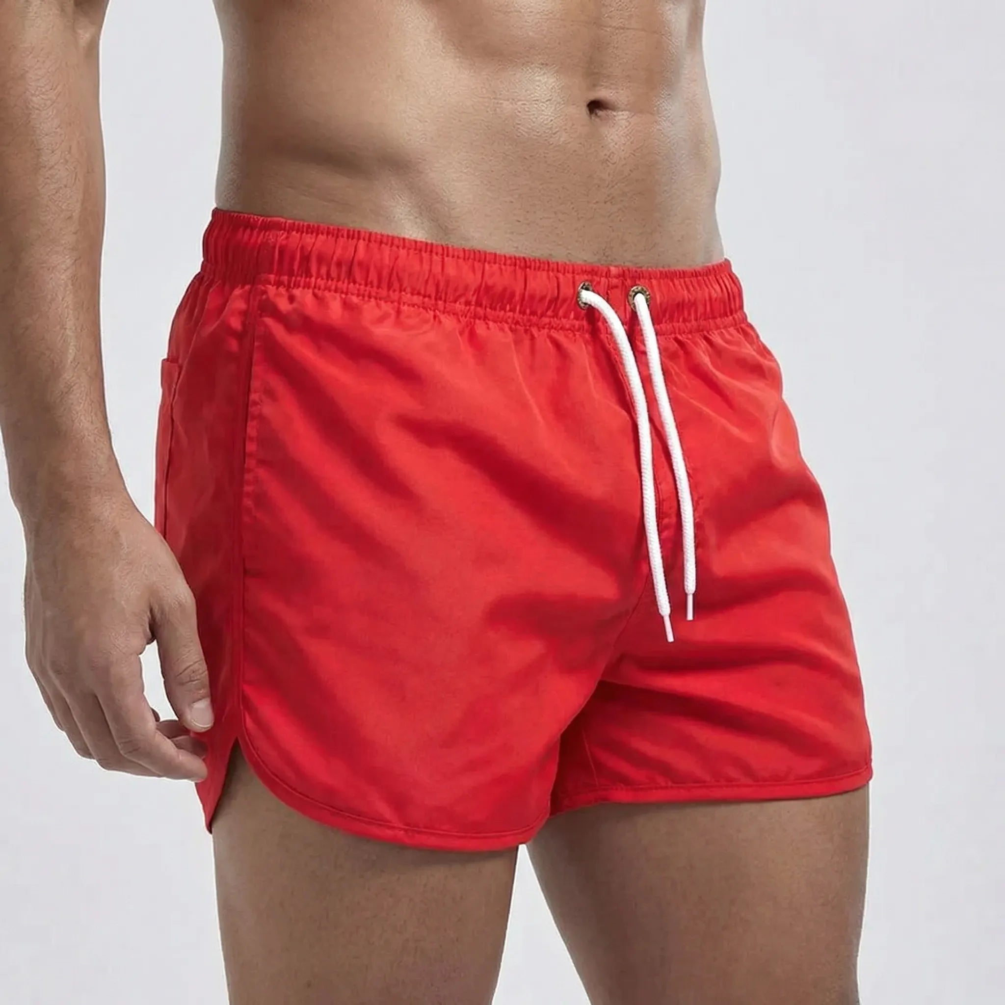 Men's low waist swim shorts with adjustable draw cord and curved hem