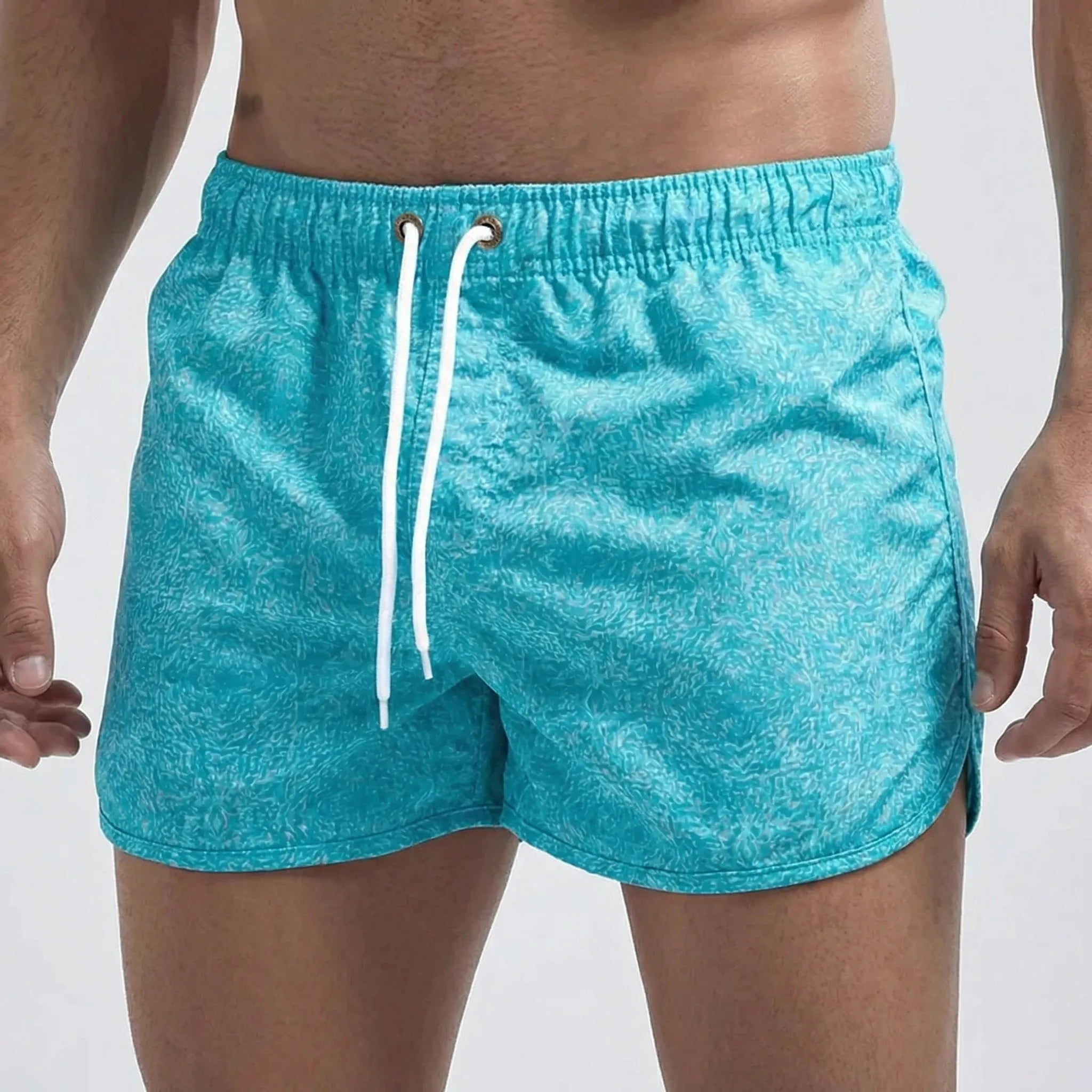 Men's low waist swim shorts with adjustable draw cord and curved hem