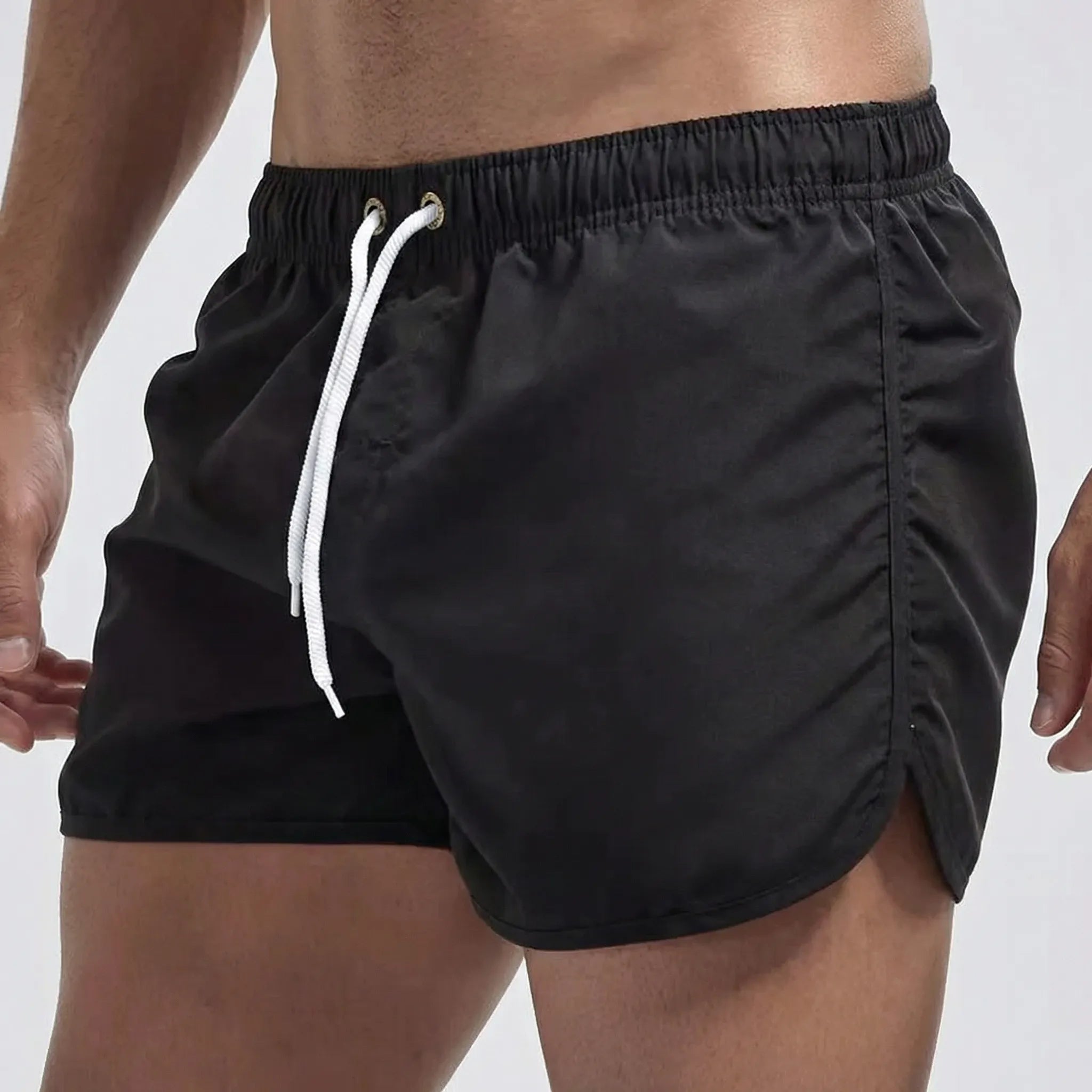Men's low waist swim shorts with adjustable draw cord and curved hem