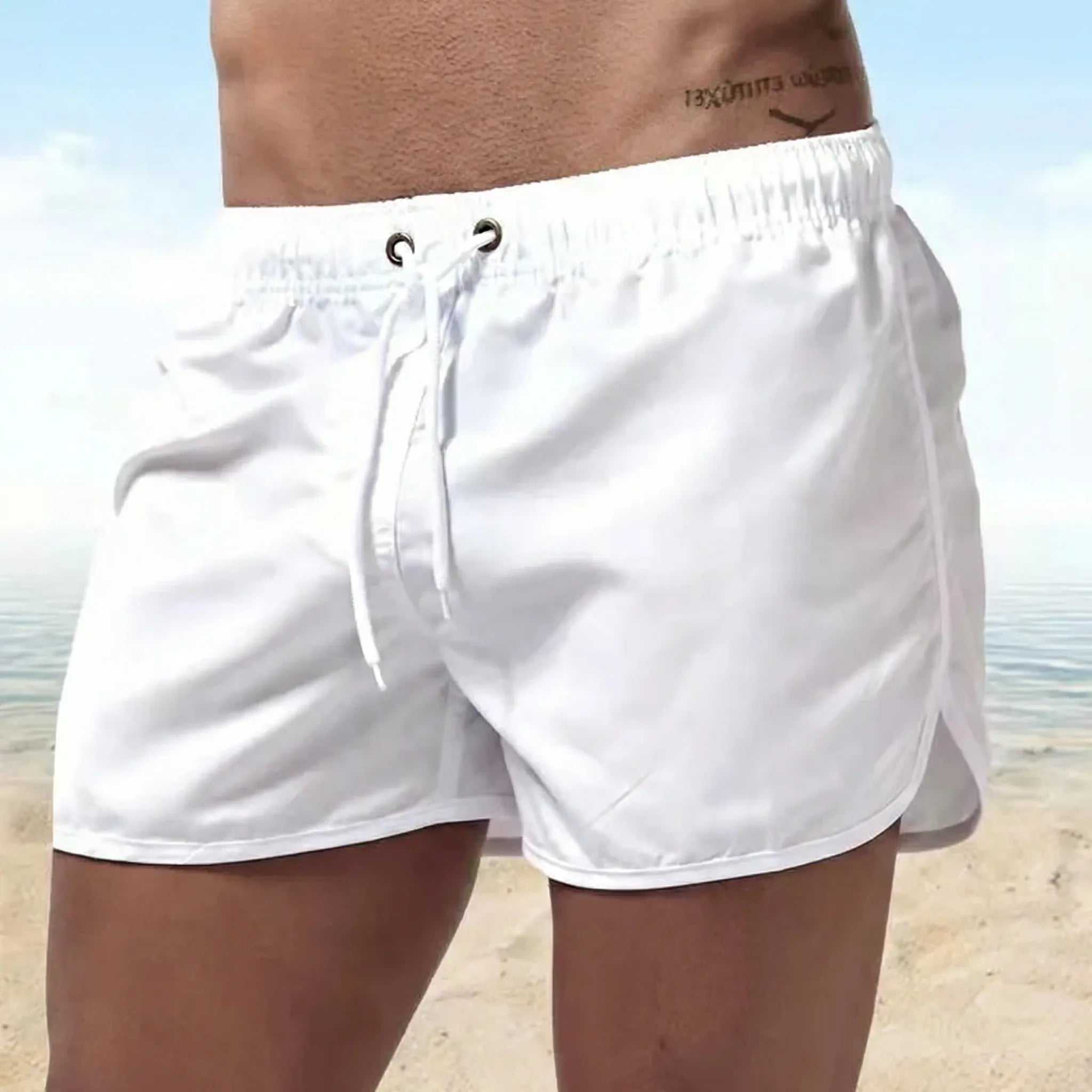 Men's low waist swim shorts with adjustable draw cord and curved hem