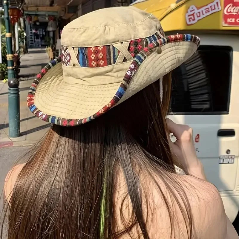 Wide-brim bucket hat with boho woven trim and adjustable chin cord
