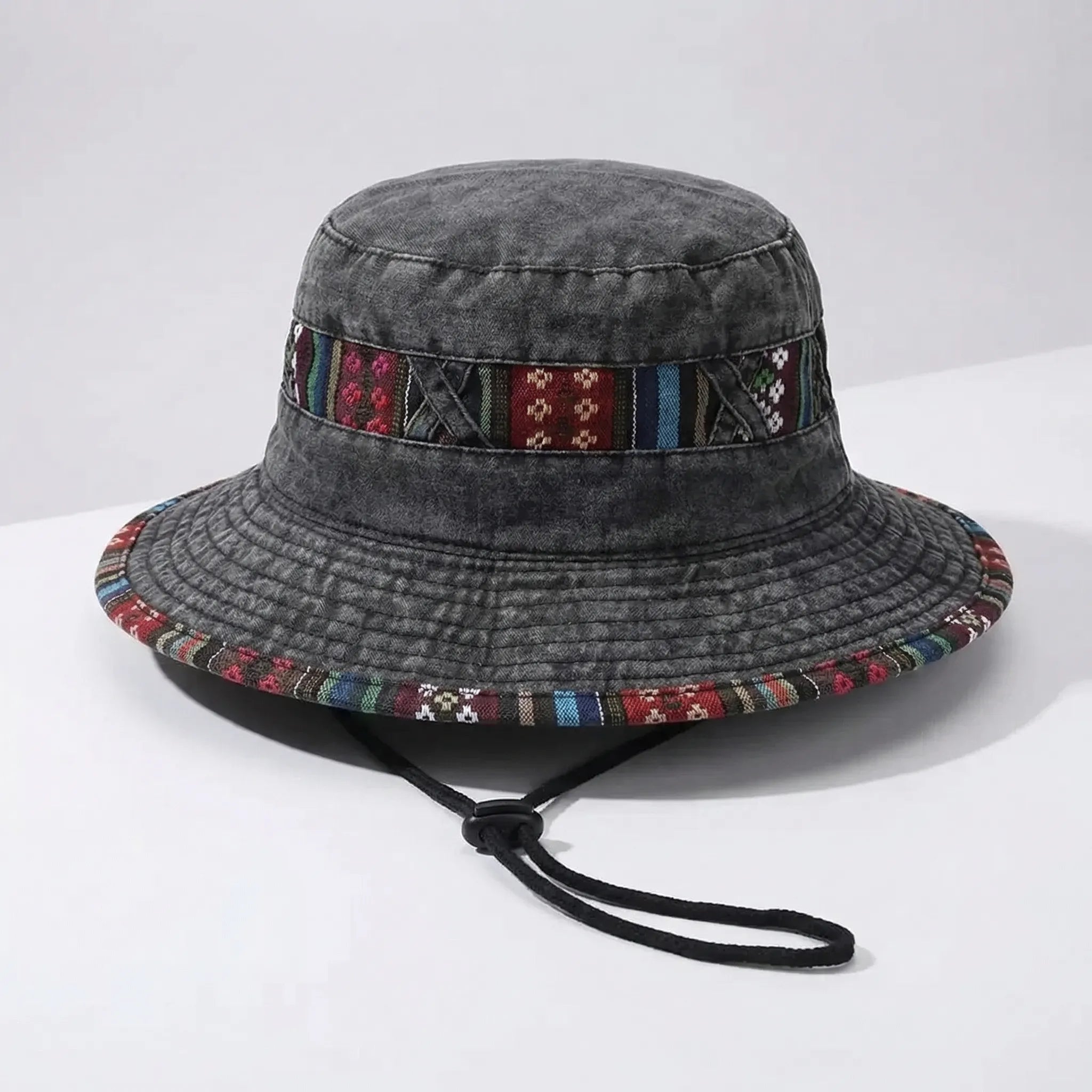 Wide-brim bucket hat with boho woven trim and adjustable chin cord
