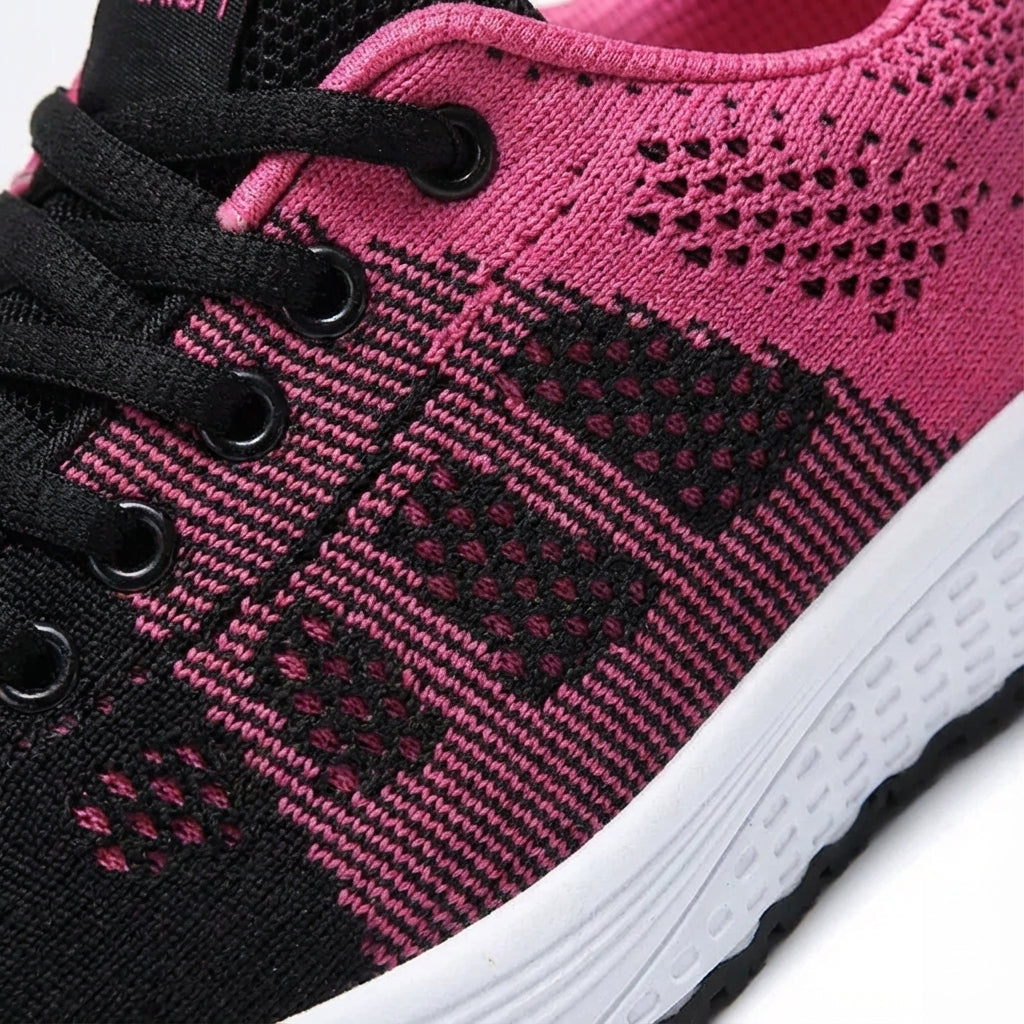 Women's low cut sport shoe with breathable mesh upper and cushioned sole