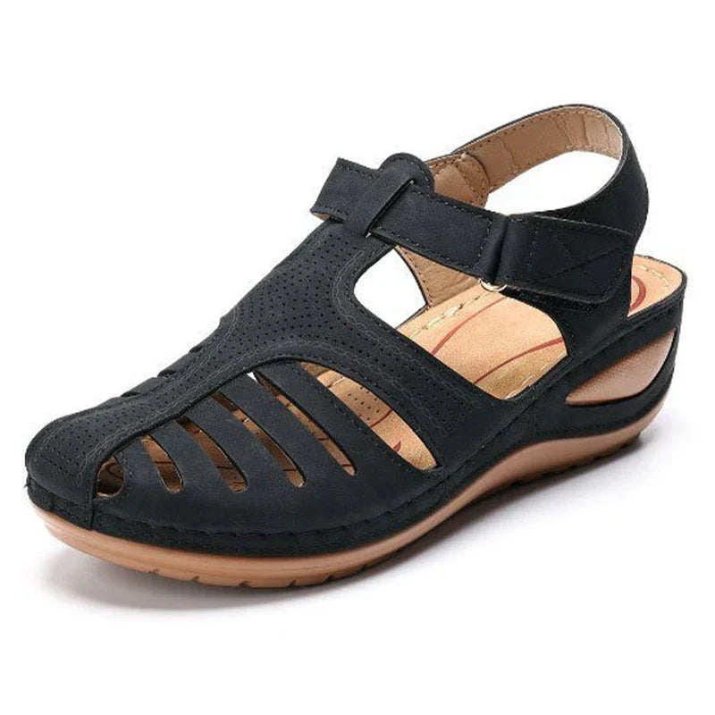 Women's summer sandal with low wedge heel, adjustable strap, and wide toe box