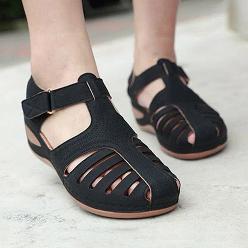 Women's summer sandal with low wedge heel, adjustable strap, and wide toe box