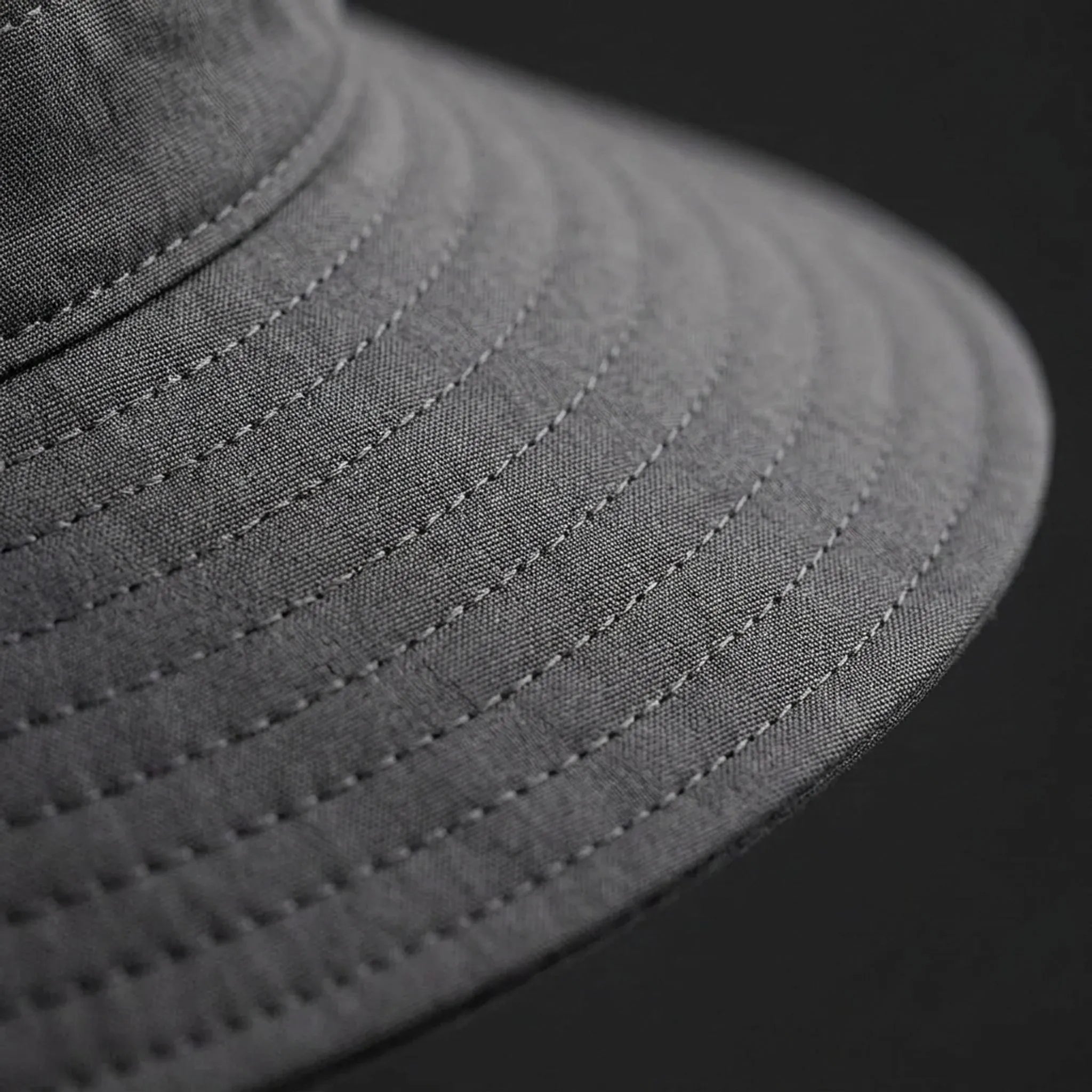 Wide-brim sun hat with mesh ventilation and rear ponytail opening