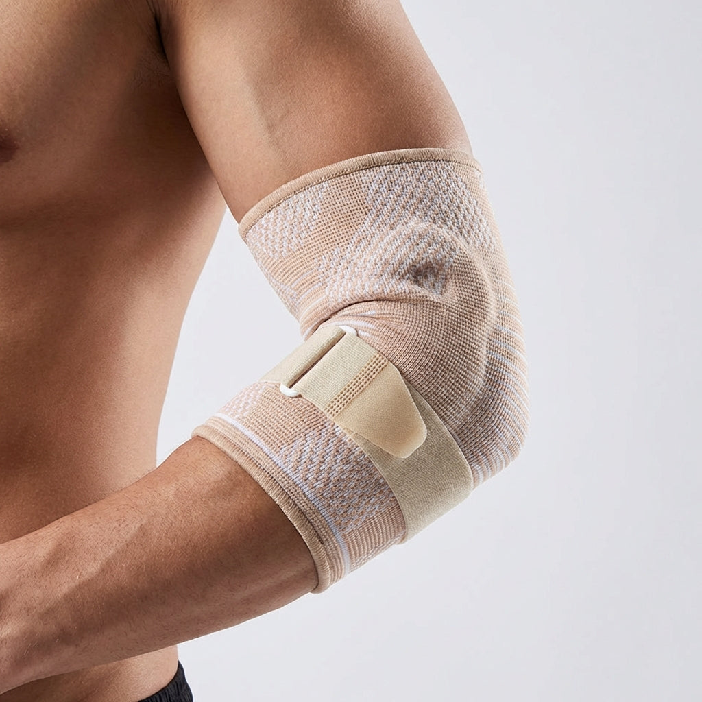 Adjustable compression elbow brace with padded support and breathable knit