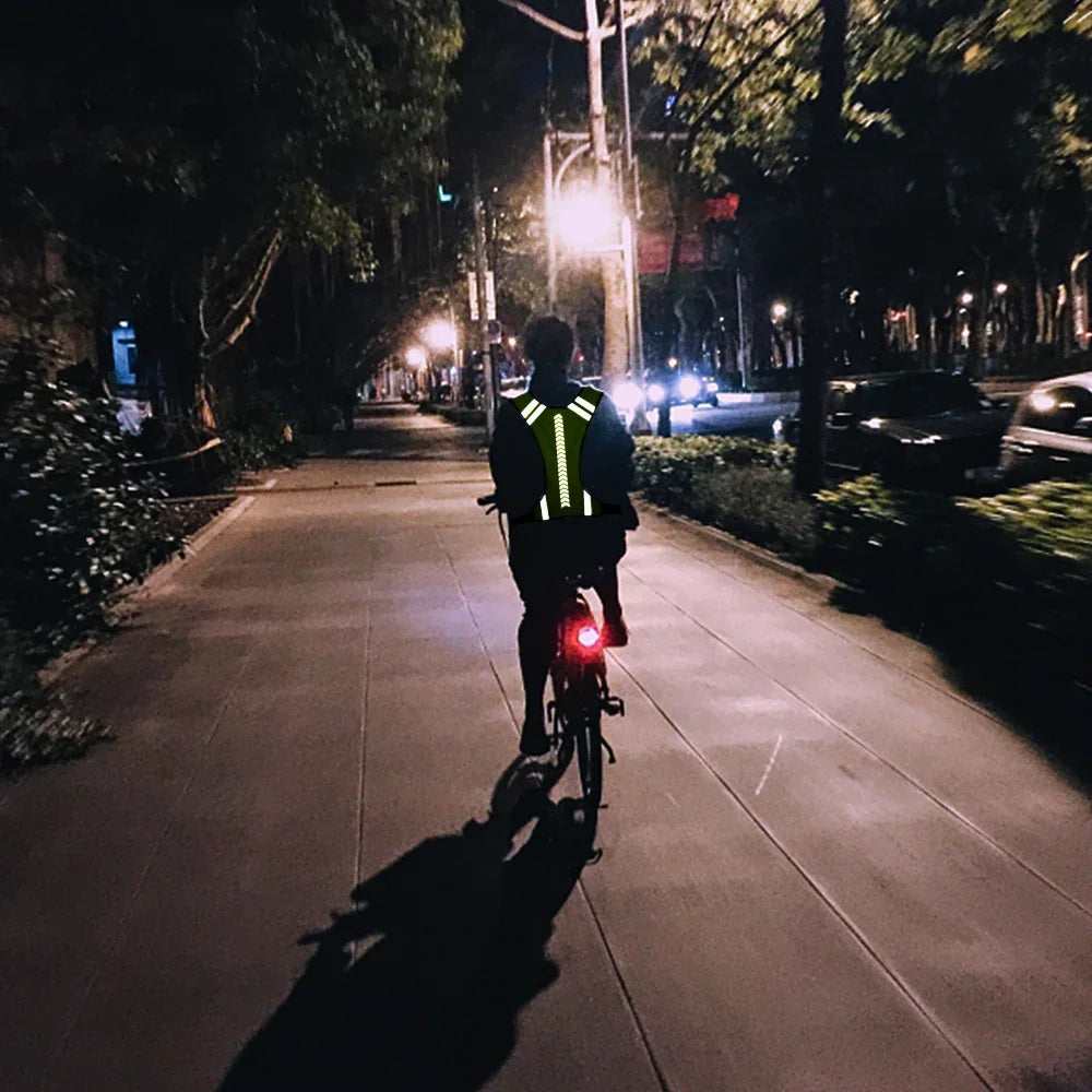 High-visibility running vest with reflective panels and V-harness design