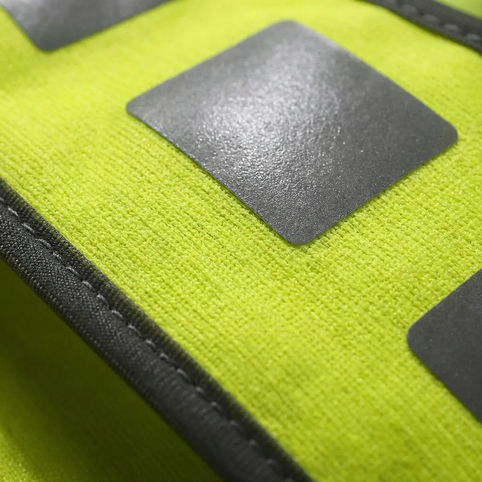 High-visibility running vest with reflective panels and V-harness design