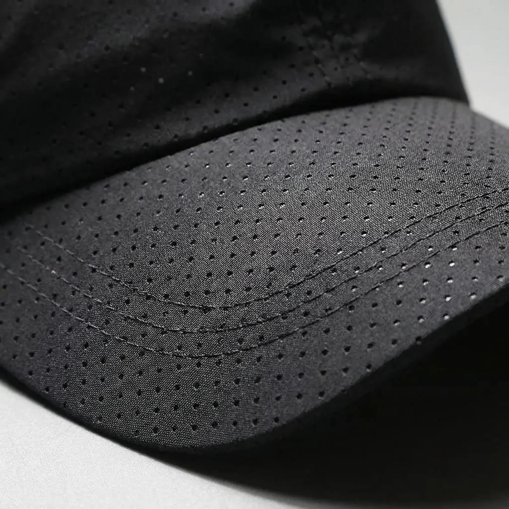Lightweight perforated baseball cap with quick-dry fabric and adjustable fit